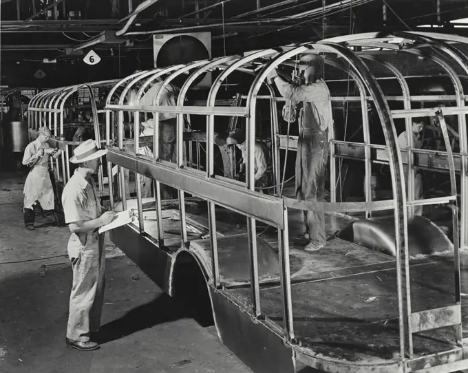 Vintage photograph. On the production line at Ward Body Works, Inc. building high strength steel frames for school bus bodies