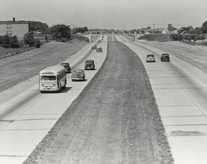 Vintage photograph. A section of the Queen Elizabeth Way just outside of Niagara Falls, Ontario, Canada which runs to Toronto