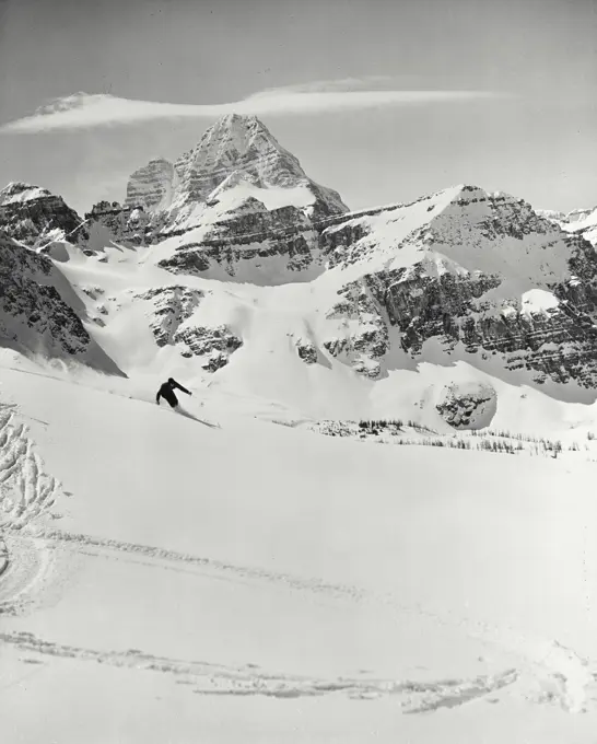 Vintage photograph. Skier on Goat Mountain run in the Mount Assiniboine area of British Columbia, Canada