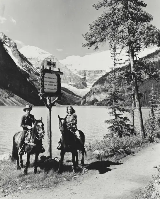 Vintage photograph. Trail riders at Lake Louise in Banff National Park, Alberta, Canada