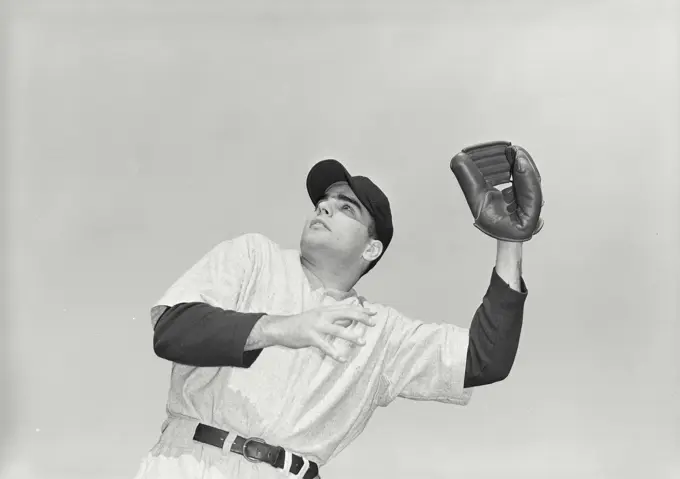 Vintage photograph. Baseball player catching ball in mitt