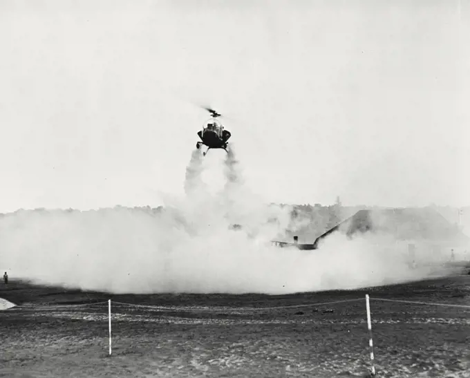 Vintage photograph. Bell helicopter performing Black fly fogging operations