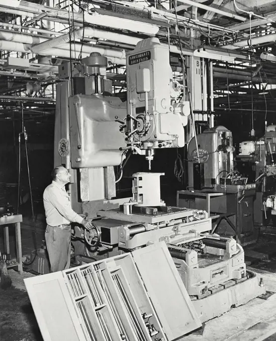 Vintage photograph. $30,000 precision drill with hydraulically moveable table in operation at Convair's San Diego Division