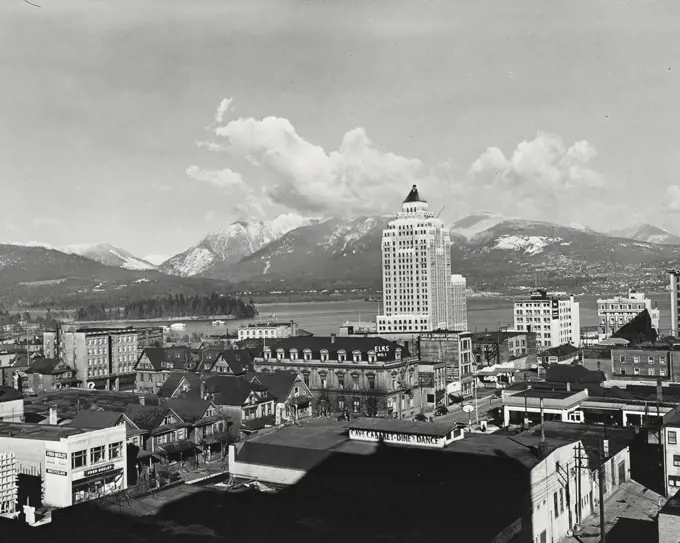 Vintage photograph. Downtown Vancouver showing marine building