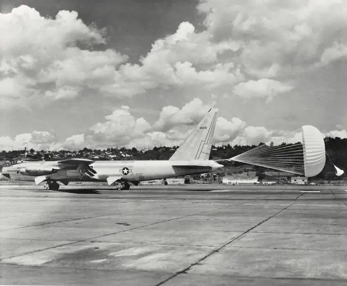 Vintage photograph. The Boeing YB-52 Stratofortress slows to a halt with the aid of its drag chute