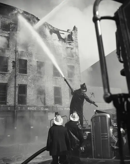 Vintage photograph. Five-alarm fire that raged through a five story export warehouse