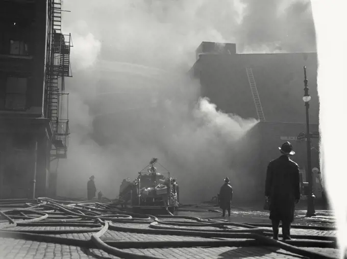 Vintage photograph. Five-alarm fire that raged through a five story export warehouse