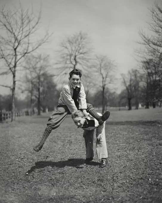 Vintage photograph. Boys playing leap frog