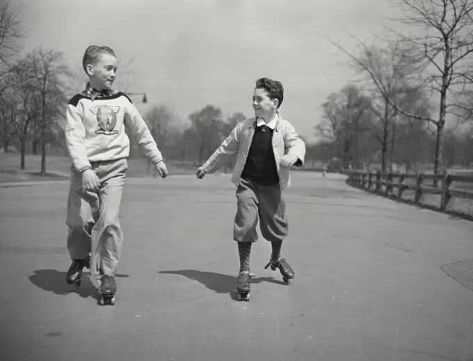 Vintage photograph. Boys in roller skates