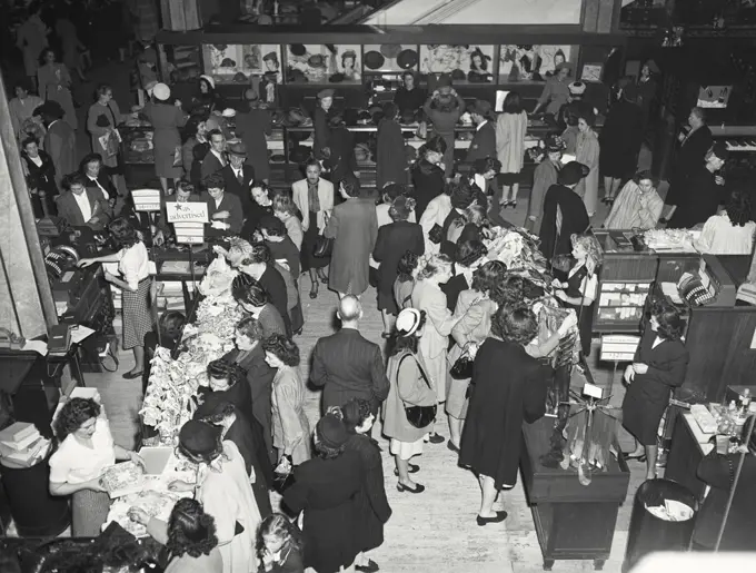 Vintage photograph. Shopping crowd on main floor of R.H. Macy Company, New York City