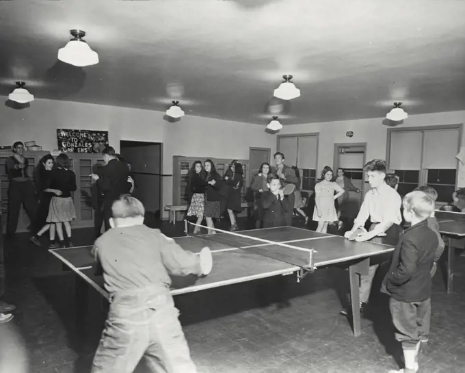 Vintage photograph. Kids playing table tennis at a party at Gonzales Gardens Public Housing, completed in September 1940 in Columbia South Carolina