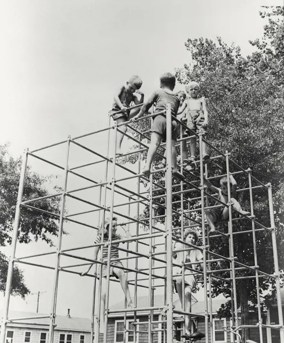 Vintage photograph. Children playing on jungle gym at Broad Creek Village Public Housing in Norfolk, Virginia