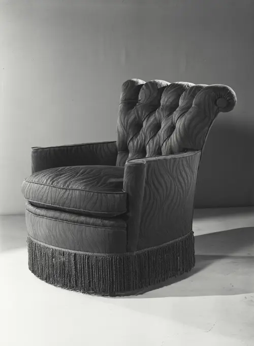 Vintage photograph. Armchair with curved frilly base