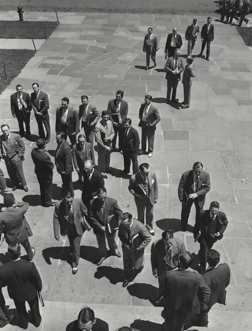 Vintage photograph. Men standing outside