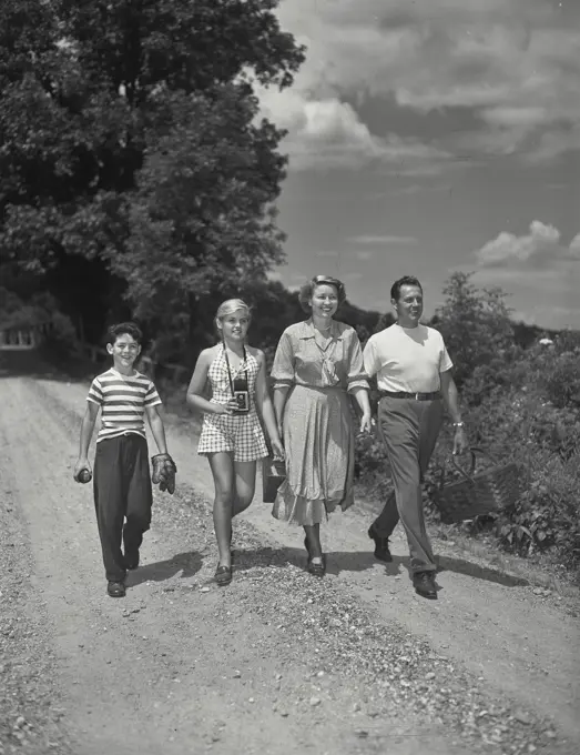 Vintage photograph. Family going for picnic