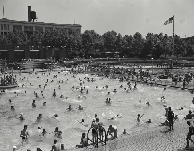 Vintage photograph. Astoria Park Pool. New York City. People playing in public pool