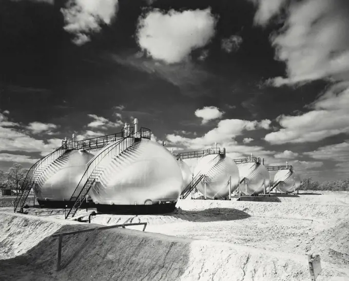 Vintage photograph. Spheroid and spherical tanks at Shell Oil Company's Sheridan, Texas cycling plant for storing under pressure natural gasoline, butane, and isobutane