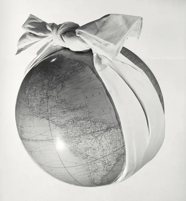 Vintage photograph. Globe wearing woman's head scarf