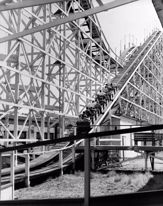 Low angle view of a group of people riding on a roller coaster, Coney Island, Brooklyn, New York City, USA