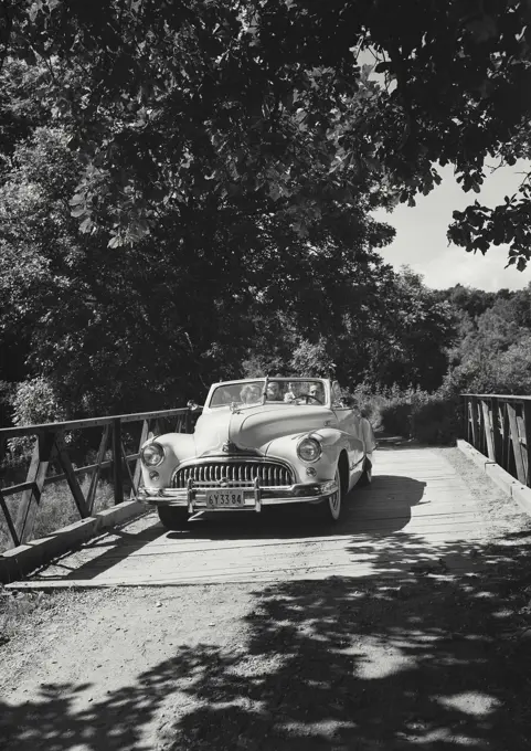 Vintage photograph. Family in car.