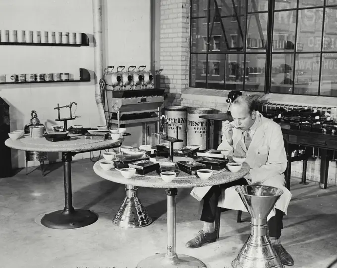 Vintage photograph. The taste test at Maxwell House coffee plant