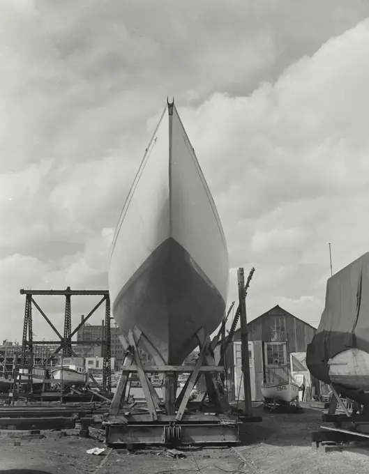 Vintage photograph. Sport sailboat in drydock