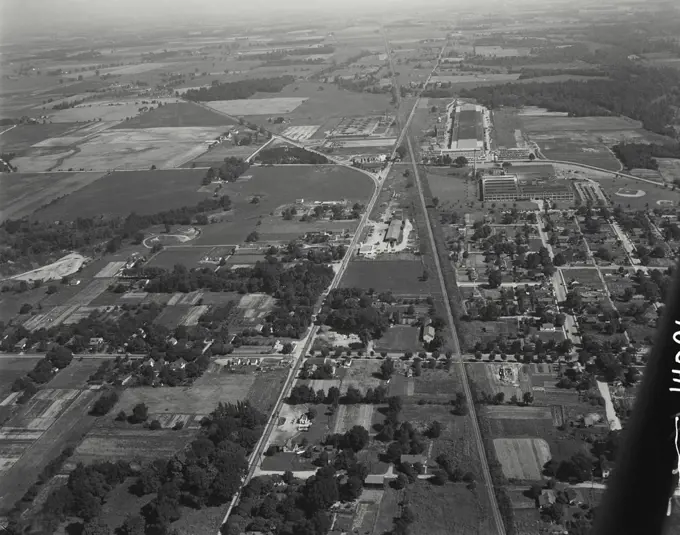 Aerial view of Richmond, Indiana with State Route 38 on the left, Farmers Co-op in center, Chesapeake and Ohio Railroad on right, along with factories of Crosley refrigerators