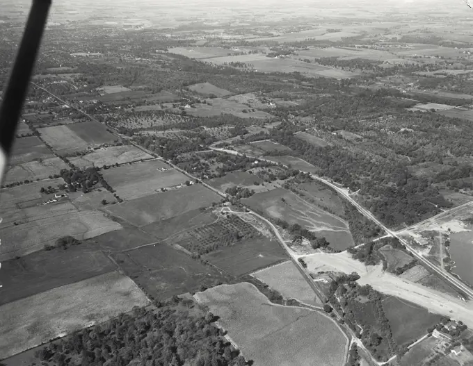 Aerial view of Richmond, Indiana. Rebuilding of Route 40 to correct a "killer intersection" with US 35. In middle distance is a section of land belonging to SW Hayes and is an Arboretum of some note