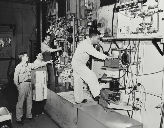 Vintage photograph. Side wall of the "hot" cubicle showing the remote control and viewing equipment for carving out inside the concrete walled cubicle.