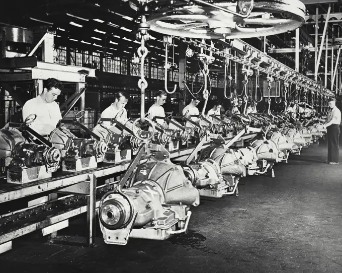 Vintage photograph. New assembly lines and conveyors for manufacturers of torque converter transmission.