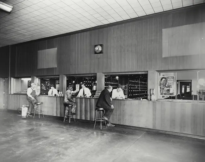 Vintage photograph. Interstate Tractor & Equipment Co. showing Caterpillar dealer parts and service department