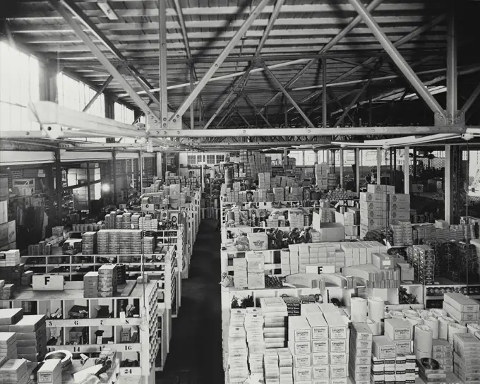 Vintage photograph. Caterpillar dealer store room full of inventory.