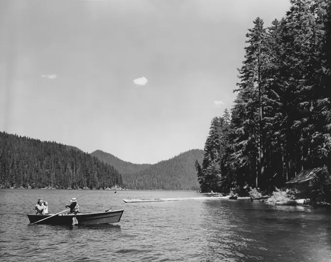 Parents with their child fishing in a lake, Spirit Lake, Washington, USA