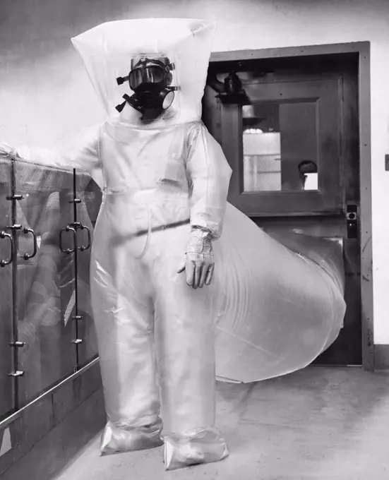 Scientist wearing an atomic suit and standing in a nuclear power station