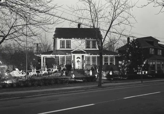 Vintage Photograph. House with christmas lights and decorations