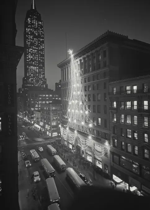 Vintage Photograph. Looking downtown showing decorations for the holidays