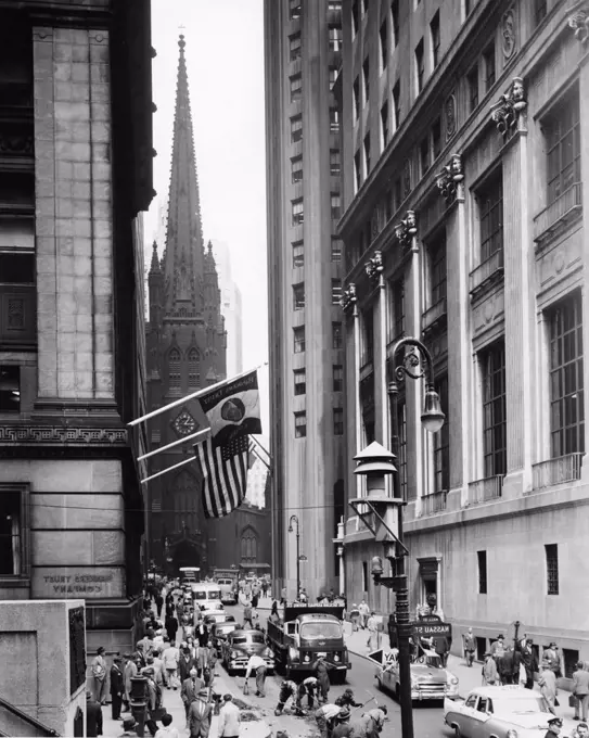 Traffic on a road in front of a church, Trinity Church, Wall Street, Manhattan, New York City, New York, USA