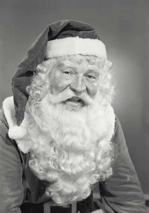 Vintage photograph. Man in Santa Claus costume smiling