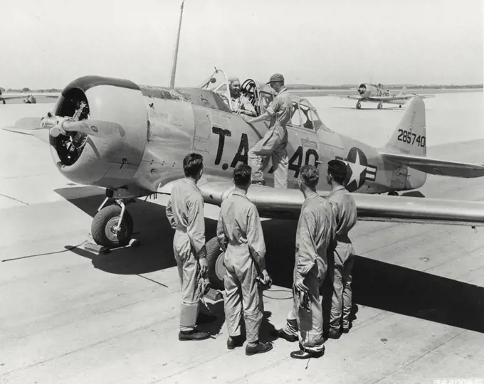 Vintage photograph. Aviation cadet at basic training at Randolph Air Force Base gets final advice from his instructor before taking a North American T-6 Texas into the air alone for the first time