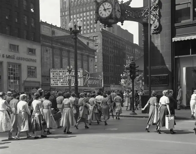 Vintage Photograph. Shopping crowd crossing street at Marshall Field Store, Chicago, Illinois