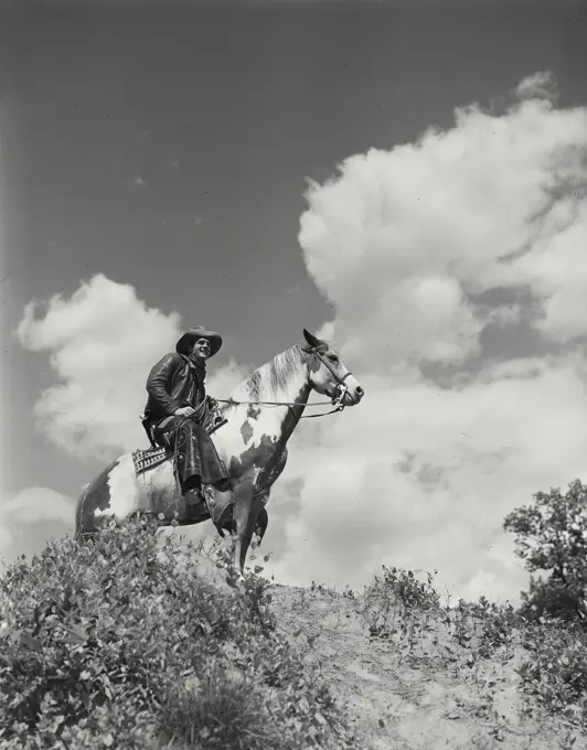 Vintage Photograph. Man riding horse inside field. Frame 19