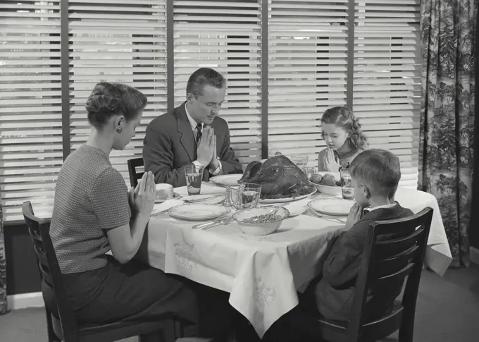 Vintage Photograph. Family at table praying before dinner. Frame 4