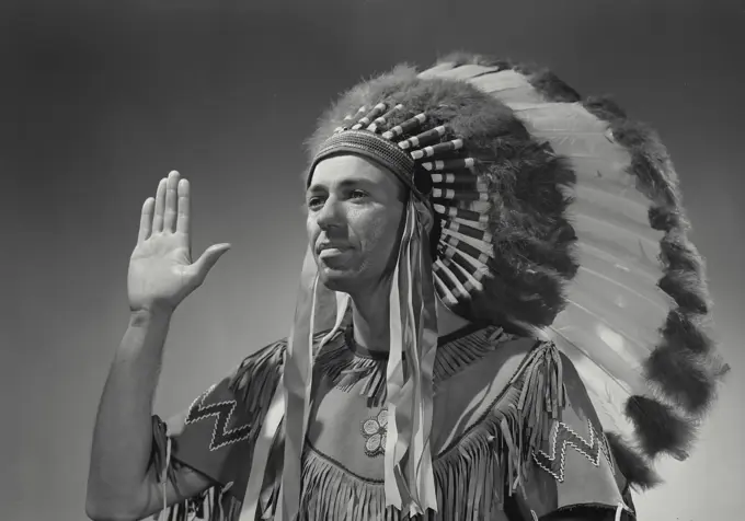 Vintage Photograph. Caucasian man in Native American head dress. Frame 5