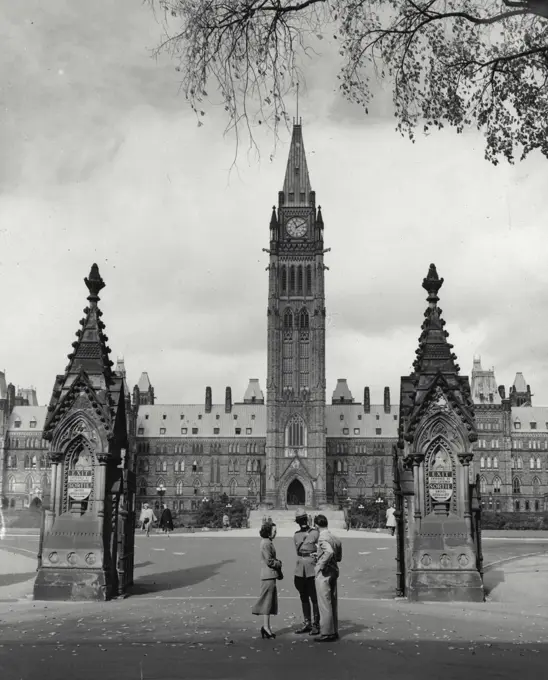 Vintage Photograph. Parliament building in Ottawa, Canada with officer out front.