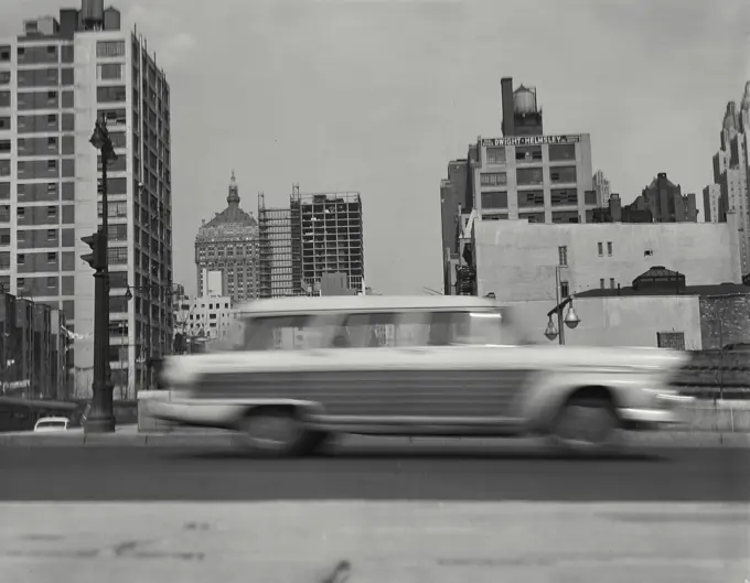 Vintage Photograph. Speeding automobile on New York City Street with buildings in background, Frame 5