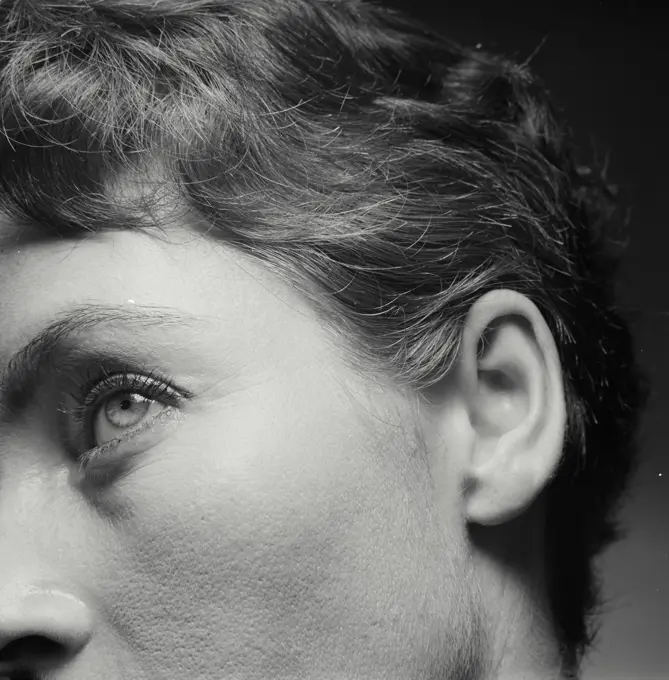 Vintage Photograph. Closeup of side of woman's eyebrow showing distance from brow to ear.