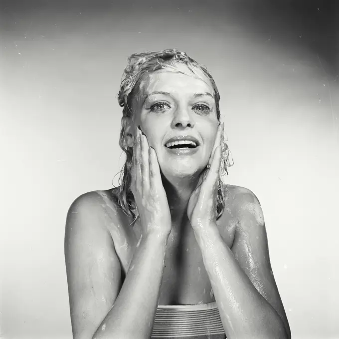 Vintage Photograph. Woman washing her face. Frame 4