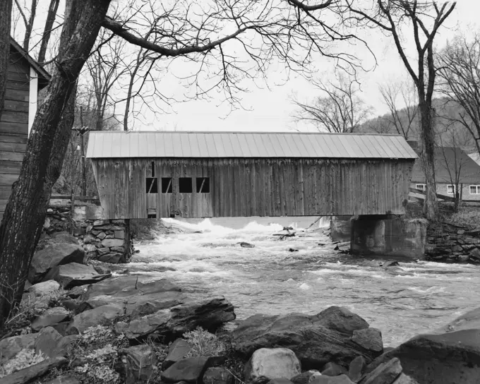 Covered bridge across a river, Tunbridge, Vermont, USA