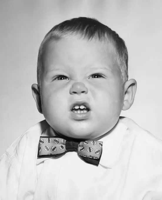 Close-up of baby boy making face