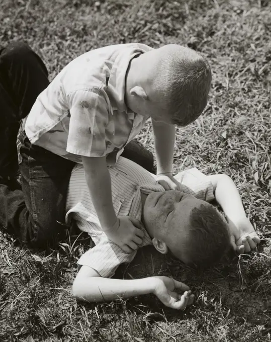 High angle view of two boys fighting